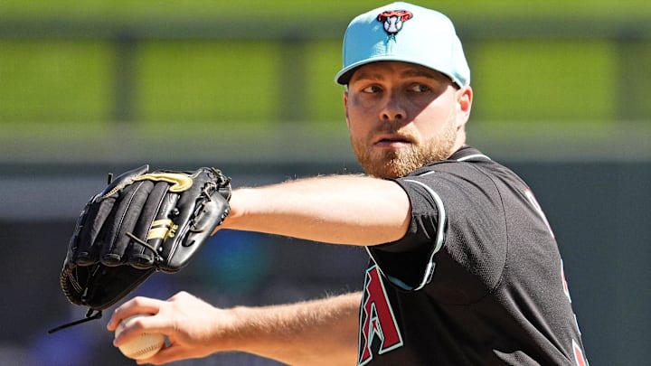 Arizona Diamondbacks pitcher Corbin Burnes warms up before facing the Milwaukee Brewers in the first inning of a spring training game on Feb. 26, 2025, in Scottsdale at Salt River Fields at Talking Stick. Arizona Diamondbacks pitcher Corbin Burnes warms up before facing the Milwaukee Brewers in the first inning of a spring training game on Feb. 26, 2025, in Scottsdale at Salt River Fields at Talking Stick.