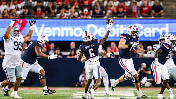 Sep 12, 2025; Tucson, Arizona, USA; Arizona Wildcats wider receiver Javin Whatley (6) throws a pass that was intercepted by the Kansas State Wildcats during the third quarter of the game at Arizona Stadium. Mandatory Credit: Aryanna Frank-Imagn Images