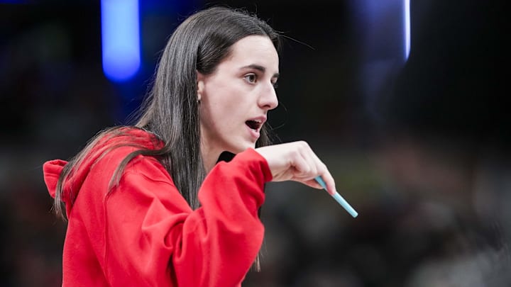 Jun 3, 2025; Indianapolis, Indiana, USA;  Indiana Fever guard Caitlin Clark (22) talks with an official during a timeout at a game between the Indiana Fever and the Washington Mystics at Gainbridge Fieldhouse in Indianapolis. Mandatory Credit:  Grace Smth- INDIANAPOLIS STAR-Imagn Images