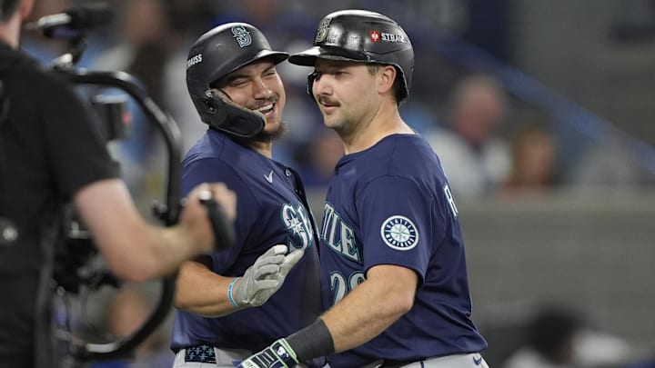 Oct 20, 2025; Toronto, Ontario, CAN; Seattle Mariners catcher Cal Raleigh (29) celebrates with first baseman Josh Naylor (12) after hitting a solo home run against the Toronto Blue Jays in the fifth inning during game seven of the ALCS round for the 2025 MLB playoffs at Rogers Centre. Mandatory Credit: John E. Sokolowski-Imagn Images Oct 20, 2025; Toronto, Ontario, CAN; Seattle Mariners catcher Cal Raleigh (29) celebrates with first baseman Josh Naylor (12) after hitting a solo home run against the Toronto Blue Jays in the fifth inning during game seven of the ALCS round for the 2025 MLB playoffs at Rogers Centre. Mandatory Credit: John E. Sokolowski-Imagn Images