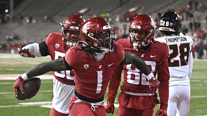 Nov 29, 2025; Pullman, Washington, USA; Washington State Cougars running back Angel Johnson (1) celebrates a a touchdown against the Oregon State Beavers in the second half at Gesa Field at Martin Stadium. Washington State Cougars won 32-8. Mandatory Credit: James Snook-Imagn Images