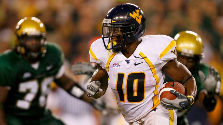 Sep 28, 2007; Tampa, FL, USA;  West Virginia Mountaineers running back Steve Slaton (10) runs during the second quarter against the South Florida Bulls at Raymond James Stadium in Tampa, Florida.  Mandatory Credit: Jason Parkhurst-USA TODAY Sports Copyright © 2007 Jason Parkhurst