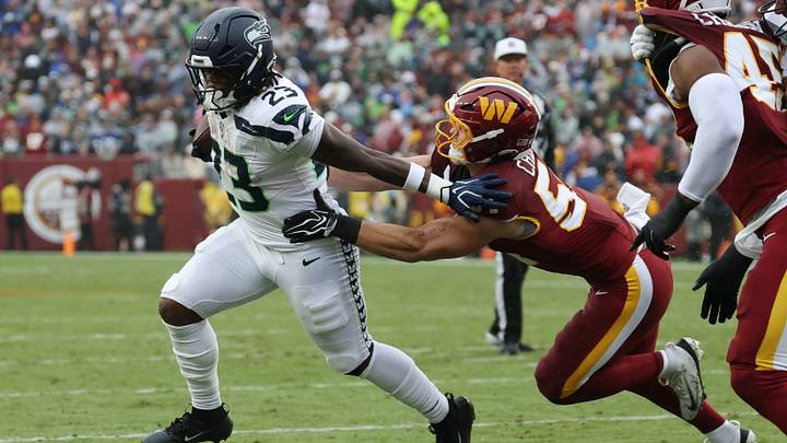 Sep 27, 2026; Landover, Maryland, USA; Seattle Seahawks running back Emanuel Wilson (23) carries the ball as Washington Commanders linebacker Leo Chenal (54) chases at Northwest Stadium. Mandatory Credit: Geoff Burke-Imagn Images Sep 27, 2026; Landover, Maryland, USA; Seattle Seahawks running back Emanuel Wilson (23) carries the ball as Washington Commanders linebacker Leo Chenal (54) chases at Northwest Stadium. Mandatory Credit: Geoff Burke-Imagn Images