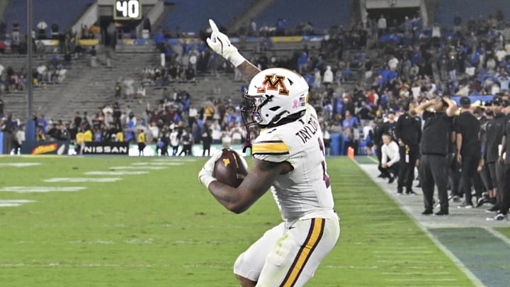 Oct 12, 2024; Pasadena, California, USA; Minnesota Golden Gophers running back Darius Taylor (1) celebrates after scoring the game-winning touchdown against the UCLA Bruins in the closing seconds at Rose Bowl. Mandatory Credit: Robert Hanashiro-Imagn Images