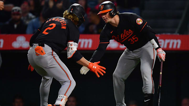 Apr 23, 2024; Anaheim, California, USA; Baltimore Orioles shortstop Gunnar Henderson (2) is greeted by catcher Adley Rutschman (35) after hitting a solo home run against the Los Angeles Angels during the seventh inning at Angel Stadium. Apr 23, 2024; Anaheim, California, USA; Baltimore Orioles shortstop Gunnar Henderson (2) is greeted by catcher Adley Rutschman (35) after hitting a solo home run against the Los Angeles Angels during the seventh inning at Angel Stadium.