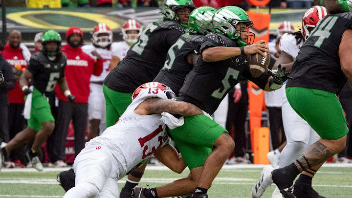 Indiana defensive lineman Kellan Wyatt sacks Oregon quarterback Dante Moore as the Oregon Ducks host the Indiana Hoosiers Oct. 11, 2025, at Autzen Stadium in Eugene, Oregon.