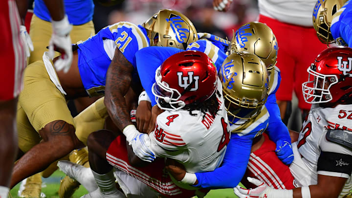 Aug 30, 2025; Pasadena, California, USA; Utah Utes quarterback Devon Dampier (4) is brought down by the against the UCLA Bruins defense during the first half at the Rose Bowl. Mandatory Credit: Gary A. Vasquez-Imagn Images Aug 30, 2025; Pasadena, California, USA; Utah Utes quarterback Devon Dampier (4) is brought down by the against the UCLA Bruins defense during the first half at the Rose Bowl. Mandatory Credit: Gary A. Vasquez-Imagn Images