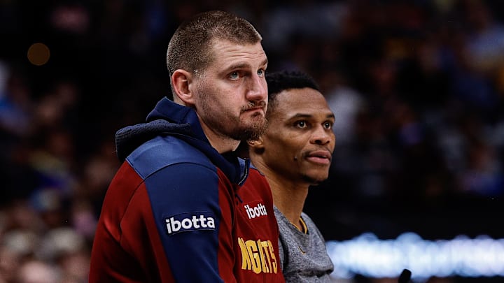 Dec 27, 2024; Denver, Colorado, USA; Denver Nuggets center Nikola Jokic (15) and guard Russell Westbrook (4) look on in the second quarter against the Cleveland Cavaliers at Ball Arena. Mandatory Credit: Isaiah J. Downing-Imagn Images