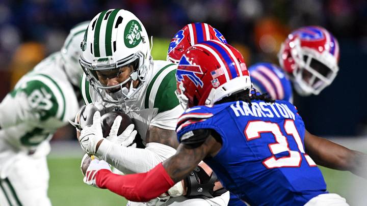 Jan 4, 2026; Orchard Park, New York, USA; New York Jets wide receiver John Metchie III (3) carries the ball defended by Buffalo Bills cornerback Maxwell Hairston (31) during the fourth quarter at Highmark Stadium. Jan 4, 2026; Orchard Park, New York, USA; New York Jets wide receiver John Metchie III (3) carries the ball defended by Buffalo Bills cornerback Maxwell Hairston (31) during the fourth quarter at Highmark Stadium.