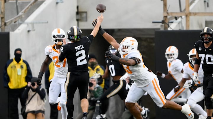 Nov 30, 2024; Nashville, Tennessee, USA;  Tennessee Volunteers defensive lineman Daevin Hobbs (53) hits Vanderbilt Commodores quarterback Diego Pavia (2) as he passes the ball during the second half at FirstBank Stadium. Mandatory Credit: Steve Roberts-Imagn Images