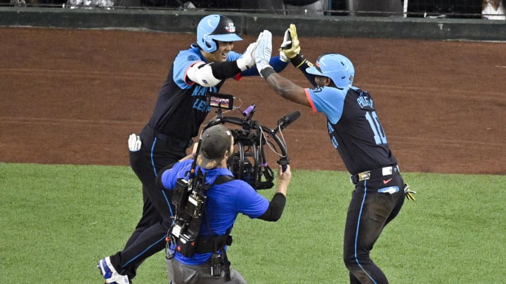 Jul 16, 2024; Arlington, Texas, USA; National League outfielder Jurickson Profar of the San Diego Padres (10) and National League designated hitter Shohei Ohtani of the Los Angeles Dodgers (17) celebrate after Ohtani hits a three run home rune against the American League during the third inning of the 2024 MLB All-Star game at Globe Life Field. Mandatory Credit: Jerome Miron-USA TODAY Sports
