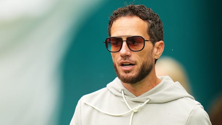 Nov 30, 2025; Miami Gardens, Florida, USA; Miami Dolphins head coach Mike McDaniel stands on the field prior to a game against the New Orleans Saints at Hard Rock Stadium. Mandatory Credit: Rich Storry-Imagn Images