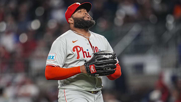Apr 9, 2025; Cumberland, Georgia, USA; Philadelphia Phillies pitcher Jose Alvarado (46) reacts after retiring the side against the Atlanta Braves during the eighth inning at Truist Park.
