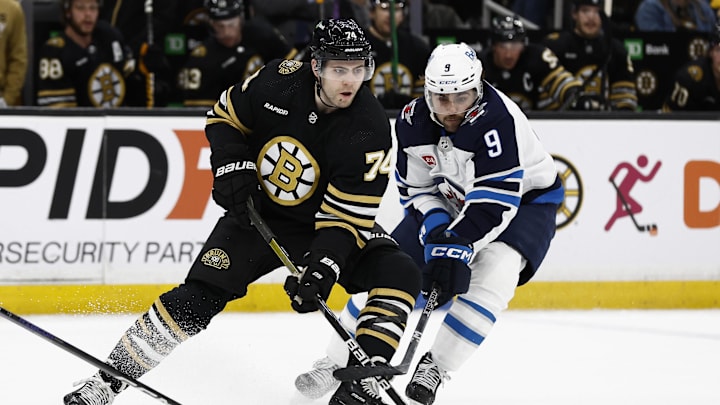 Jan 22, 2024; Boston, Massachusetts, USA; Winnipeg Jets left wing Alex Iafallo (9) tries to slow