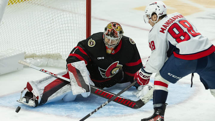 Jan 16, 2025; Ottawa, Ontario, CAN; Ottawa Senators goalie Leevi Merilainen (1) makes a save on a shot from Washington Capitals left wing Andrew Mangiapane (88) in the third period at the Canadian Tire Centre. Mandatory Credit: Marc DesRosiers-Imagn Images