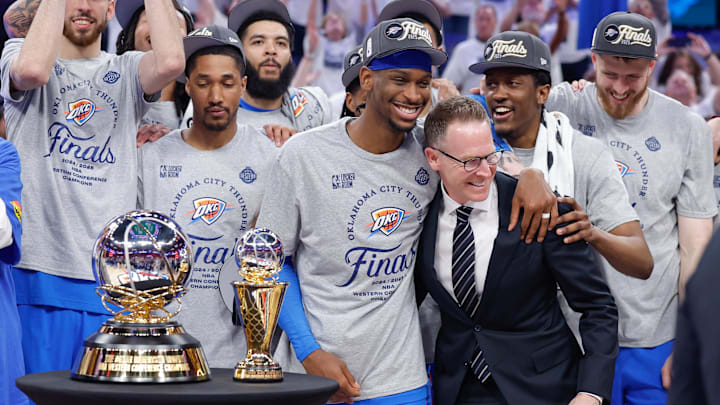 May 28, 2025; Oklahoma City, Oklahoma, USA; Oklahoma City Thunder guard Shai Gilgeous-Alexander hugs Oklahoma City Thunder executive vice president and general manager Sam Presti after their team defeated the Minnesota Timberwolves in game five of the western conference finals for the 2025 NBA Playoffs at Paycom Center. Mandatory Credit: Alonzo Adams-Imagn Images