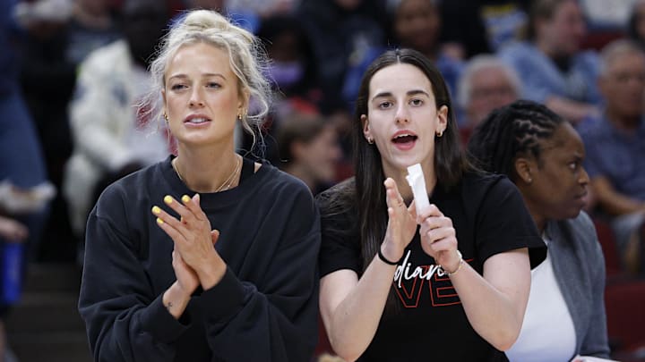 Jun 7, 2025; Chicago, Illinois, USA; Injured Indiana Fever guard Sophie Cunningham (8) and guard Caitlin Clark (22) react from the bench during the first half of a WNBA game against the Chicago Sky at United Center. Mandatory Credit: Kamil Krzaczynski-Imagn Images