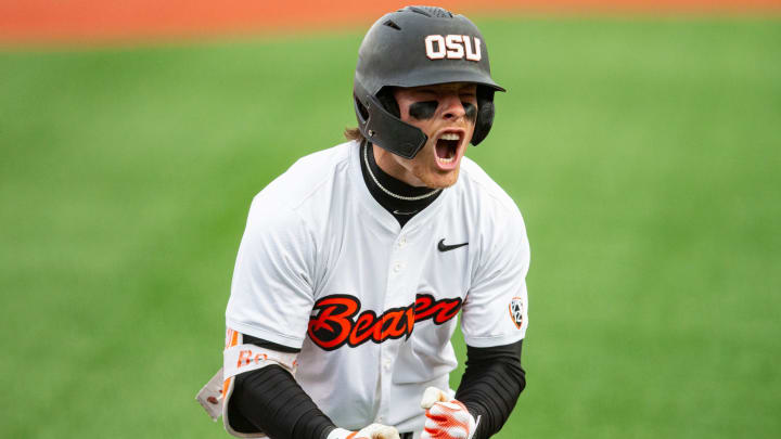 Oregon State's Travis Bazzana (37) celebrates after hitting the team's second solo home run during an NCAA college baseball game against Oregon at Goss Stadium on Friday, April 26, 2024, in Corvallis, Ore.