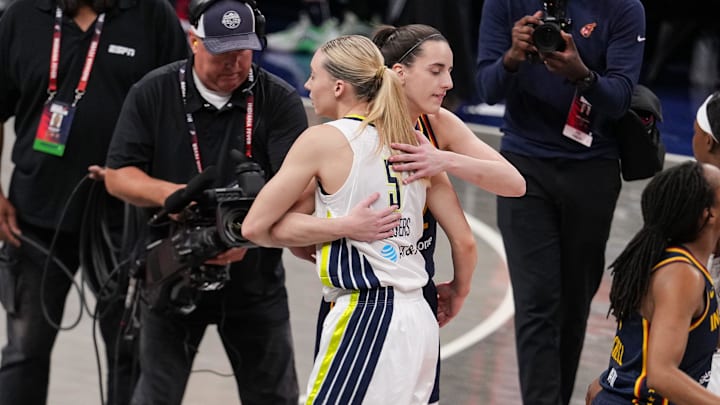 Indiana Fever guard Caitlin Clark (22) and Dallas Wings guard Paige Bueckers (5) hug Sunday, July 13, 2025, ahead of the game at Gainbridge Fieldhouse in Indianapolis.