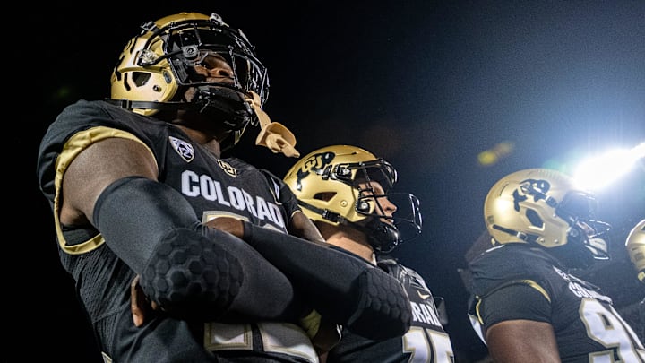 CU football athlete Travis Hunter poses during the coin toss before the Rocky Mountain Showdown.