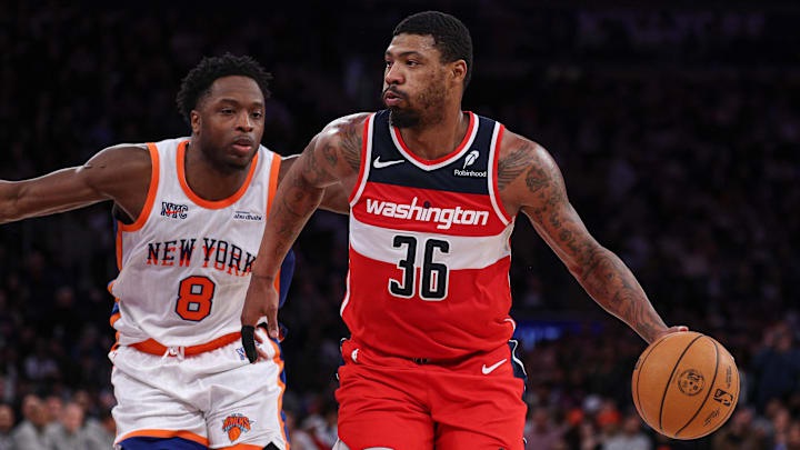 Mar 22, 2025; New York, New York, USA; Washington Wizards guard Marcus Smart (36) dribbles up court in front of New York Knicks forward OG Anunoby (8) during the second half at Madison Square Garden. Mandatory Credit: Vincent Carchietta-Imagn Images