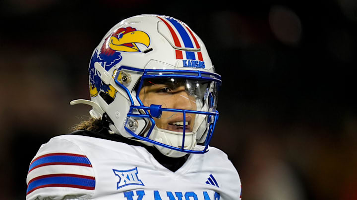 Kansas Jayhawks quarterback Jason Bean (9) looks off into the sideline during the NCAA college