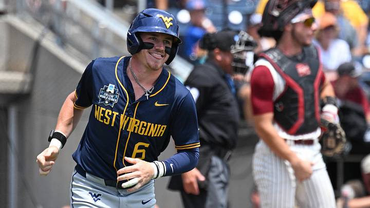 Jun 16, 2026; Omaha, NE, USA; West Virginia Mountaineers center fielder Paul Schoenfeld (6) reacts after walking against the Troy Trojans during the first inning at Charles Schwab Field. Mandatory Credit: Steven Branscombe-Imagn Images Jun 16, 2026; Omaha, NE, USA; West Virginia Mountaineers center fielder Paul Schoenfeld (6) reacts after walking against the Troy Trojans during the first inning at Charles Schwab Field. Mandatory Credit: Steven Branscombe-Imagn Images