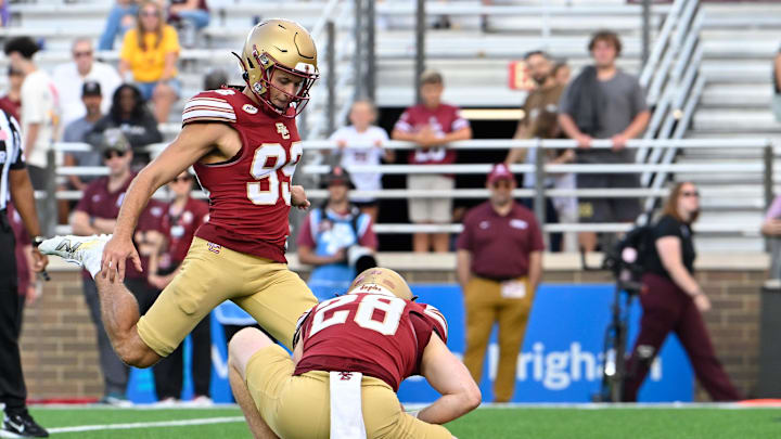 Aug 30, 2025; Chestnut Hill, Massachusetts, USA; Boston College Eagles place kicker Luca Lombardo (99) kicks an extra point against the Fordham Rams during the second half at Alumni Stadium. Mandatory Credit: Eric Canha-Imagn Images