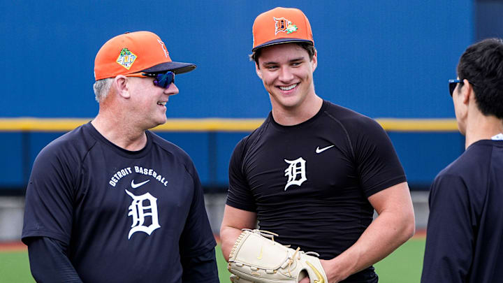 Detroit Tigers manager A.J. Hinch, left, talks to pitcher Jackson Jobe during spring training at TigerTown in Lakeland, Fla. on Monday, Feb. 16, 2026.