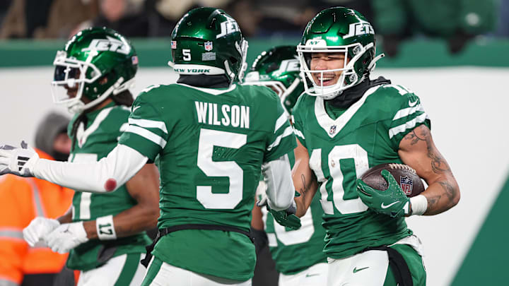 Jan 5, 2025; East Rutherford, New Jersey, USA; New York Jets wide receiver Allen Lazard (10) celebrates his touchdown reception with wide receiver Garrett Wilson (5) during the first half against the Miami Dolphins at MetLife Stadium. Mandatory Credit: Vincent Carchietta-Imagn Images Jan 5, 2025; East Rutherford, New Jersey, USA; New York Jets wide receiver Allen Lazard (10) celebrates his touchdown reception with wide receiver Garrett Wilson (5) during the first half against the Miami Dolphins at MetLife Stadium. Mandatory Credit: Vincent Carchietta-Imagn Images