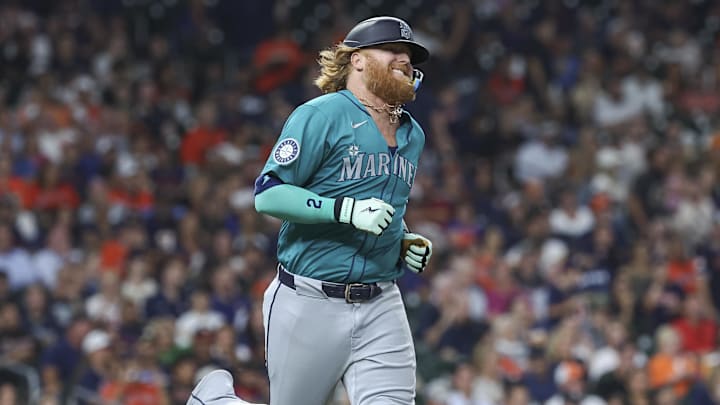 Sep 23, 2024; Houston, Texas, USA; Seattle Mariners designated hitter Justin Turner (2) runs to first base after hitting a single during the seventh inning against the Houston Astros at Minute Maid Park.