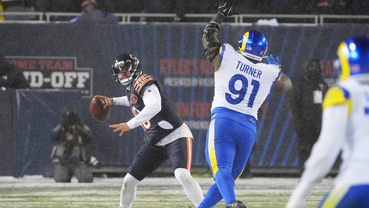 Caleb Williams throws a pass against the Rams as defensive end Kobie Turner closes in duking last season's playoffs. Caleb Williams throws a pass against the Rams as defensive end Kobie Turner closes in duking last season's playoffs.