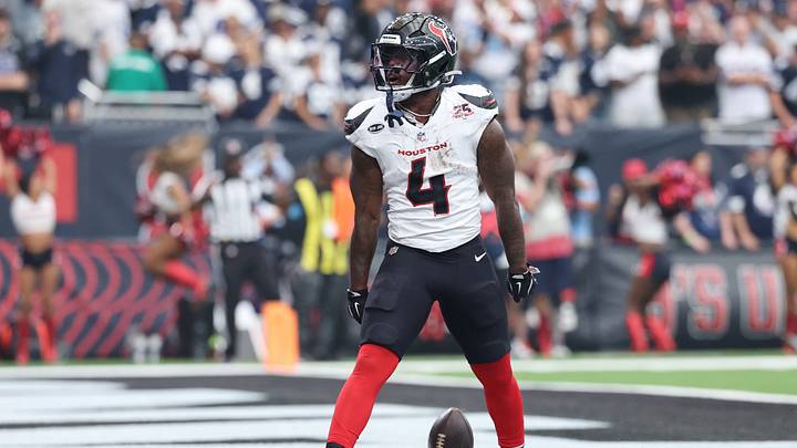 Houston Texans running back Woody Marks (4) reacts after scoring a touchdown against the Dallas Cowboys during the second half at Reliant Stadium.  Mandatory Credit: Troy Taormina-Imagn Images