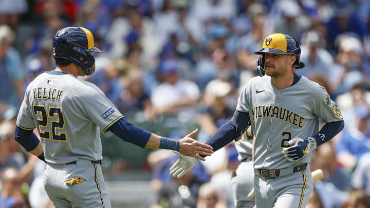 Aug 21, 2025; Chicago, Illinois, USA; Milwaukee Brewers second baseman Brice Turang (2) celebrates with designated hitter Christian Yelich (22) after hitting a two-run home run against the Chicago Cubs during the second inning at Wrigley Field. Mandatory Credit: Kamil Krzaczynski-Imagn Images Aug 21, 2025; Chicago, Illinois, USA; Milwaukee Brewers second baseman Brice Turang (2) celebrates with designated hitter Christian Yelich (22) after hitting a two-run home run against the Chicago Cubs during the second inning at Wrigley Field. Mandatory Credit: Kamil Krzaczynski-Imagn Images