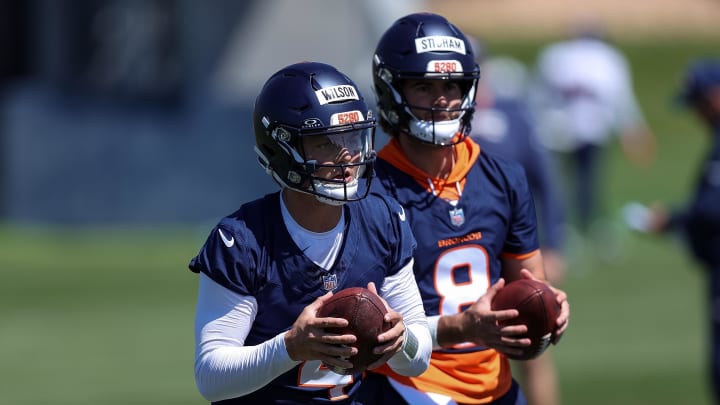 May 23, 2024; Englewood, CO, USA; Denver Broncos quarterback Zach Wilson (4) and quarterback Jarrett Stidham (8) during organized team activities at Centura Health Training Center.