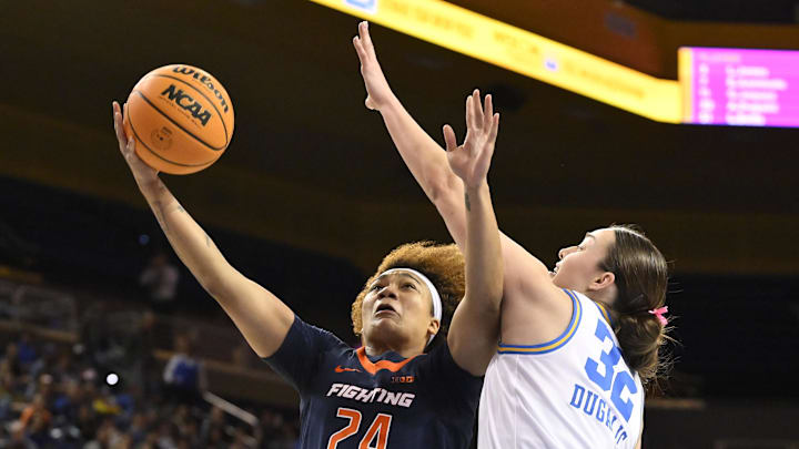 Feb 20, 2025; Los Angeles, California, USA; Illinois Fighting Illini guard Adalia McKenzie (24) tries to score past UCLA Bruins forward Angela Dugalic (32) during the firsts quarter at Pauley Pavilion presented by Wescom. Mandatory Credit: Robert Hanashiro-Imagn Images Feb 20, 2025; Los Angeles, California, USA; Illinois Fighting Illini guard Adalia McKenzie (24) tries to score past UCLA Bruins forward Angela Dugalic (32) during the firsts quarter at Pauley Pavilion presented by Wescom. Mandatory Credit: Robert Hanashiro-Imagn Images