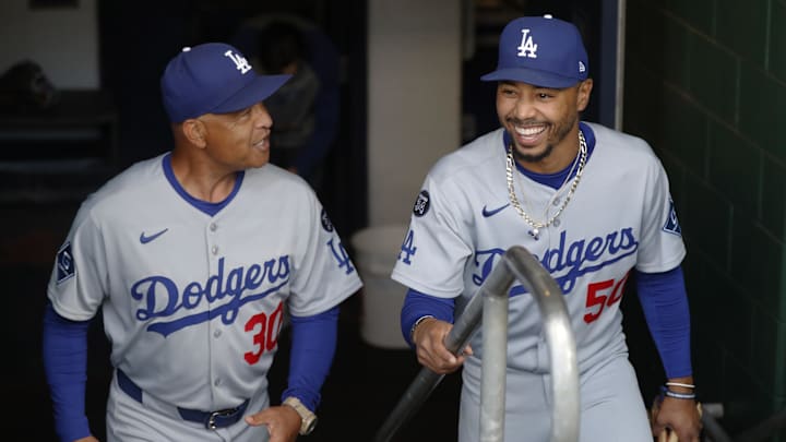Sep 2, 2025; Pittsburgh, Pennsylvania, USA; Los Angeles Dodgers manager Dave Roberts (30) and shortstop Mookie Betts (50) enter the dugout o play he Pittsburgh Pirates at PNC Park. Mandatory Credit: Charles LeClaire-Imagn Images
