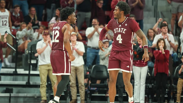 Mar 1, 2025; Starkville, Mississippi, USA; Mississippi State Bulldogs guard Josh Hubbard (12) and forward Cameron Matthews (4) celebrate during the second half against the LSU Tigers at Humphrey Coliseum. Mandatory Credit: Wesley Hale-Imagn Images