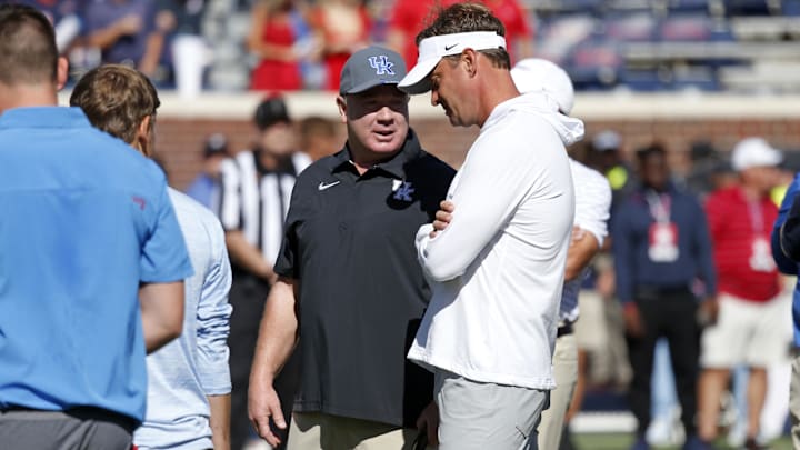 Oct 1, 2022; Oxford, Mississippi, USA; Kentucky Wildcats head coach Mark Stoops (left) and