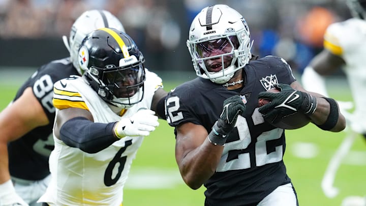 Oct 13, 2024; Paradise, Nevada, USA; Las Vegas Raiders running back Alexander Mattison (22) looks to evade the tackle attempt of Pittsburgh Steelers linebacker Patrick Queen (6) during the first quarter at Allegiant Stadium. Mandatory Credit: Stephen R. Sylvanie-Imagn Images Oct 13, 2024; Paradise, Nevada, USA; Las Vegas Raiders running back Alexander Mattison (22) looks to evade the tackle attempt of Pittsburgh Steelers linebacker Patrick Queen (6) during the first quarter at Allegiant Stadium. Mandatory Credit: Stephen R. Sylvanie-Imagn Images