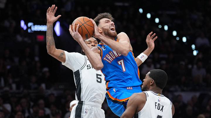 Oct 20, 2026; San Antonio, Texas, USA;  Oklahoma City Thunder center Chet Holmgren (7) goes up in between San Antonio Spurs guards Stephon Castle (5) and De'aaron Fox (4) in the first at Frost Bank Center.  Mandatory Credit: Daniel Dunn-Imagn Images