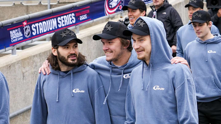 Mar 1, 2025; Columbus, Ohio, USA; Columbus Blue Jackets Kirill Marchenko, left, Dmitri Voronkov, center, and Daniil Tarasov walk into the stadium before the NHL Stadium Series game between the Columbus Blue Jackets and the Detroit Red Wings  at Ohio Stadium. Mandatory Credit: Samantha Madar/USA TODAY Network via Imagn Images
