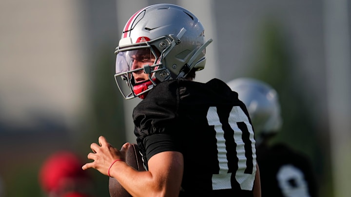 Ohio State Buckeyes quarterback Julian Sayin (10) takes a snap during football training camp at the Woody Hayes Athletic Center on Aug. 1, 2025.