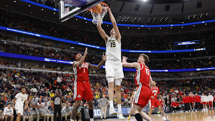 Mar 13, 2026; Chicago, IL, USA; Michigan Wolverines center Aday Mara (15) scores against the Ohio State Buckeyes during the second half at United Center. Mandatory Credit: Kamil Krzaczynski-Imagn Images