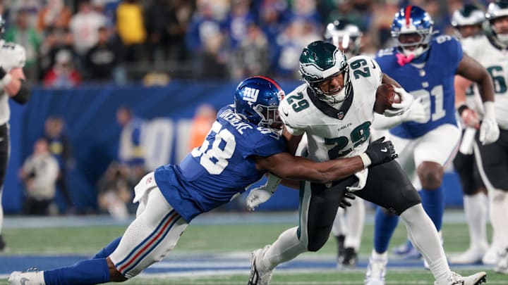 Oct 9, 2025; East Rutherford, New Jersey, USA; Philadelphia Eagles running back AJ Dillon (29) avoids a tackle by New York Giants linebacker Bobby Okereke (58) during the fourth quarter of the game at MetLife Stadium. Mandatory Credit: Vincent Carchietta-Imagn Images Oct 9, 2025; East Rutherford, New Jersey, USA; Philadelphia Eagles running back AJ Dillon (29) avoids a tackle by New York Giants linebacker Bobby Okereke (58) during the fourth quarter of the game at MetLife Stadium. Mandatory Credit: Vincent Carchietta-Imagn Images