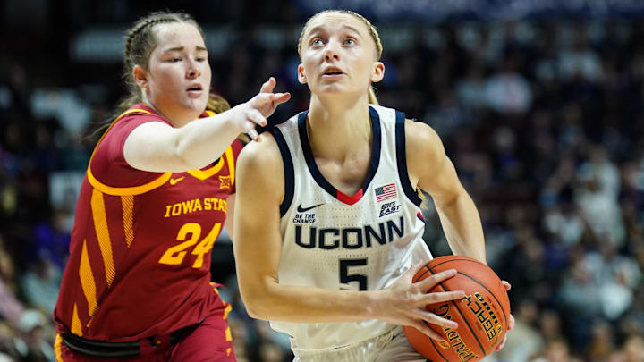 Dec 17, 2024; Uncasville, Connecticut, USA; UConn Huskies guard Paige Bueckers (5) drives the ball to the basket against Iowa State Cyclones forward Addy Brown (24) in the second half at Mohegan Sun Arena. Mandatory Credit: David Butler II-Imagn Images