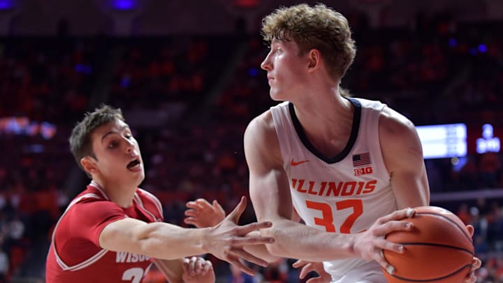 Dec 10, 2024; Champaign, Illinois, USA; Illinois Fighting Illini guard Kasparas Jakucionis (32) looks to pass as Wisconsin Badgers guard Jack Janicki (33) pressures him during the second half at State Farm Center. Mandatory Credit: Ron Johnson-Imagn Images Dec 10, 2024; Champaign, Illinois, USA; Illinois Fighting Illini guard Kasparas Jakucionis (32) looks to pass as Wisconsin Badgers guard Jack Janicki (33) pressures him during the second half at State Farm Center. Mandatory Credit: Ron Johnson-Imagn Images