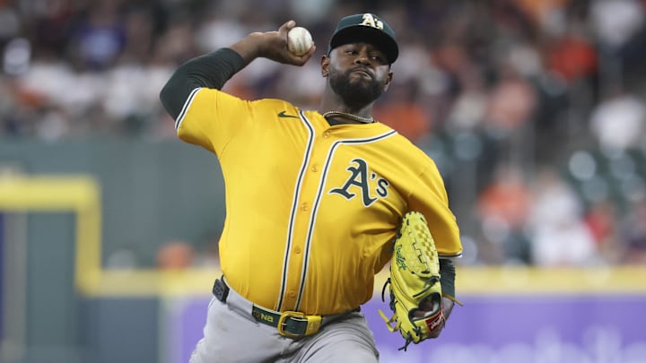 Jul 24, 2025; Houston, Texas, USA;  Athletics starting pitcher Luis Severino (40) delivers a pitch during the second inning against the Houston Astros at Daikin Park. Mandatory Credit: Troy Taormina-Imagn Images