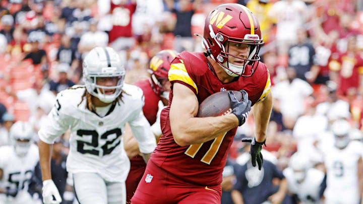 Sep 21, 2025; Landover, Maryland, USA; Washington Commanders wide receiver Luke McCaffrey (11) runs for a touchdown during the second half against the Las Vegas Raiders at Northwest Stadium. Mandatory Credit: Amber Searls-Imagn Images