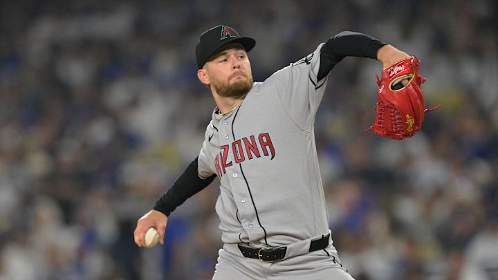 Mar 27, 2026; Los Angeles, California, USA;  Arizona Diamondbacks pitcher Ryne Nelson (19) pitches against the Los Angeles Dodgers in the second inning at Dodger Stadium. Mandatory Credit: Jayne Kamin-Oncea-Imagn Images